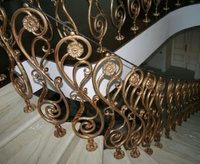 Перила кованые для поворотной лестницы на основе вензельного орнамента