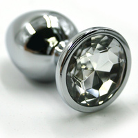 Маленькая алюминиевая анальная пробка Kanikule Small с кристаллом – серебристый с прозрачным Beauty Brands Limited